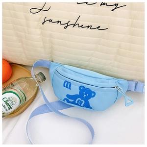 Detail of light blue kids chest bag with cartoon bear print and adjustable strap