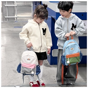 Detail view of large capacity color-block school backpacks with multiple mesh side pockets