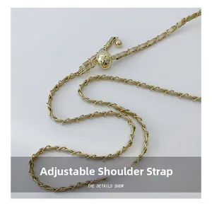 Detail of adjustable metal ball clasp and woven gold chain strap for children's bag