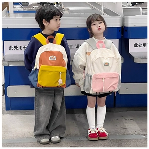Outdoor view of large capacity kids backpacks with color-blocking and mountain logo patches