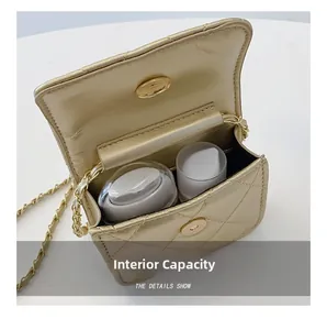 Detail view of the mini quilted bag interior with metal chain and magnetic clasp