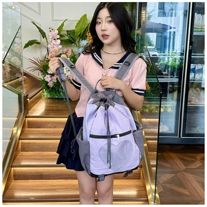 Detail view of purple contrast backpack featuring a heart-shaped transparent window design