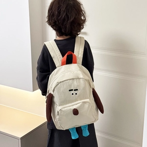 Zaino per bambini a forma di cane in tela beige con pinne blu e maniglia arancione