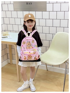 Pink cartoon capybara backpack for kids shown with top handle and front zipper pocket
