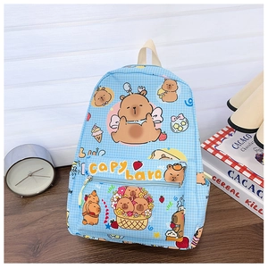 Detail of blue plaid kids backpack featuring cute capybara prints and front zipper pocket