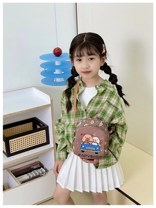 Close-up of brown nylon kids crossbody bag featuring a cute cartoon capybara driver print