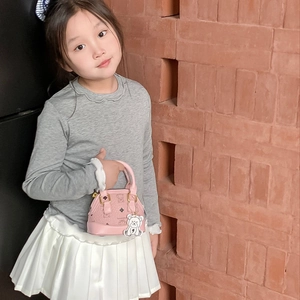 Pink mini crossbody bag for kids with teddy bear print and cartoon mascot charm
