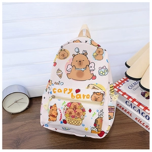 Detailed view of pink plaid kids backpack with cute Capybara patterns and front pocket