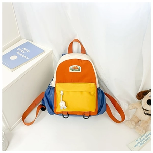 Detail of color-block canvas kids backpack with front zip pocket and brand logo