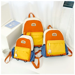 Detailed set of three colorful waterproof nylon backpacks in small, medium, and large sizes
