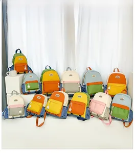 Detailed view of colorful large capacity school backpacks with multi-pocket design and charms