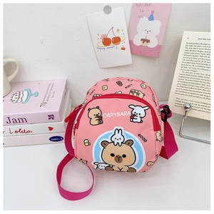 Pink kids crossbody bag featuring cute cartoon capybara print and adjustable shoulder strap