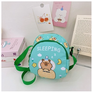 Detail of mint green capybara crossbody bag with sleeping print and zipper pockets
