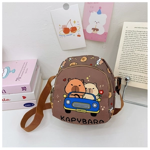 Close-up of brown kids capybara printed crossbody bag with adjustable shoulder strap