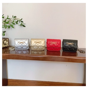Quilted mini crossbody bags for girls with golden bow accents in four classic colors