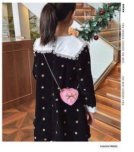 Pink heart-shaped quilted crossbody bag for girls with gold bow and chain strap detail