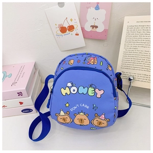 Close-up of blue canvas crossbody bag for kids featuring cartoon bear prints and honey text