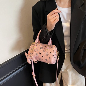 Pink kitten print boston bag with litchi texture shown in a lifestyle model shot