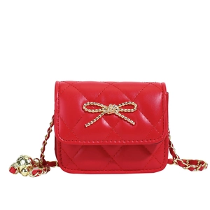 Red quilted mini shoulder bag for girls with golden bow and adjustable chain strap