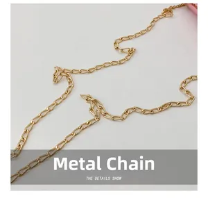 Detailed close-up of premium golden metal chain strap for kids heart crossbody bag