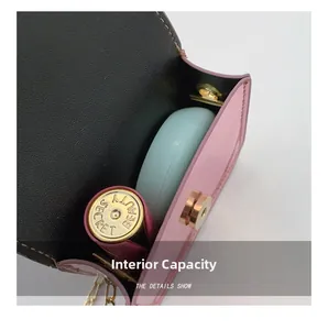 Internal view of pink mini bag showing magnetic buckle and compact storage space