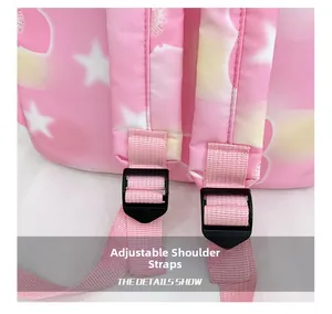 Detailed view of adjustable padded shoulder straps on pink star pattern school backpack