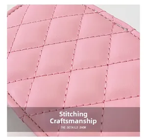 Close-up of pink leather cross-stitch diamond pattern on kids' chain shoulder bag