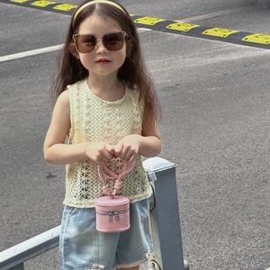 Girl's mini pink cylinder bucket bag with summer lace top and denim shorts outfit