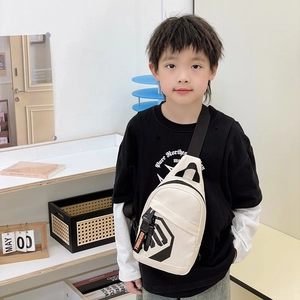 Modern white canvas chest bag for boys featuring black geometric logo and adjustable strap