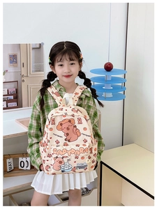 Detail view of large capacity kids backpack with cute Capybara print and front pocket