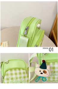 Close-up of green plaid shoulder bag with smooth PU leather and cute puppy charm