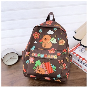 Detail of Capybara printed school bag with front zipper pocket and camping theme pattern