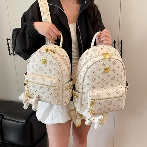 Ensemble sac à dos en cuir blanc cassé avec motif chat et garnitures dorées