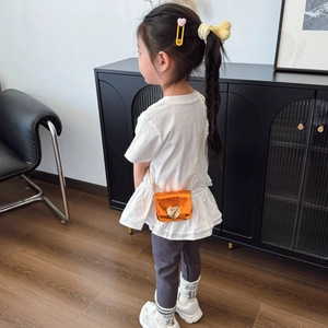 Mini orange crossbody bag for kids with gold heart lock and elegant metal chain strap