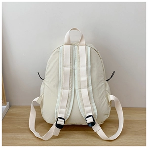 Detailed back view of off-white minimalist backpack with adjustable straps and texture