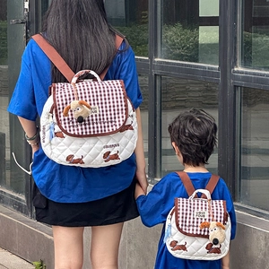 Cute cartoon puppy parent-child backpack set with white quilting and brown plaid detail