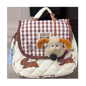 Cute quilted puppy backpack for kids featuring a brown plaid flap and plush dog pendant