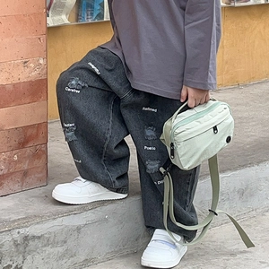 Kids streetwear crossbody bag in light green nylon with distressed printed denim jeans