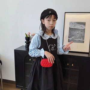 Kids' blue shirt and black embroidered dress set with a red quilted chain crossbody bag