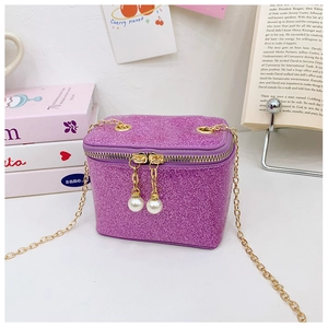 Detail of purple sequin crossbody bag for kids with gold chain and large pearl pendants