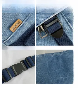 Detailansicht der Denim-Textur mit braunem Lederlogo und robustem Nylon-Gurtband