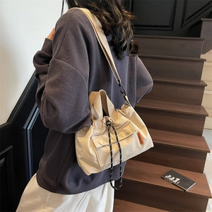 Sac seau en toile pour femme avec cordon de serrage et bandoulière réglable en beige
