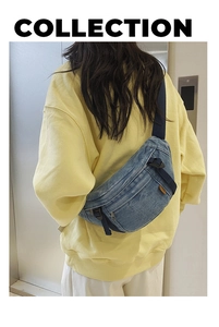 Detailansicht der gewaschenen Denim-Umhängetasche mit Reißverschlüssen und Gurt