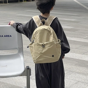 Minimalist lightweight large capacity beige school backpack for boys and girls