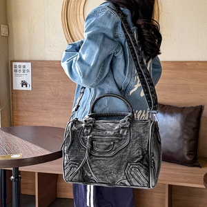 Vintage dark washed denim motorcycle shoulder bag with braided handles and silver hardware
