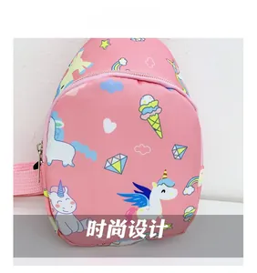 Close-up of pink kids chest bag with colorful unicorn, rainbow and heart prints