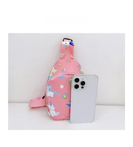 Pink cartoon unicorn chest bag shown next to a smartphone to demonstrate the mini size