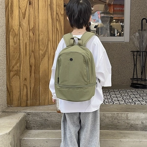 Olive green large capacity children's backpack with minimalist design and dual compartments