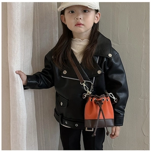 Mini orange leather bucket bag for kids with drawstring closure and crossbody strap