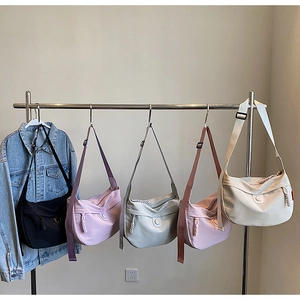 Hobo canvas crossbody bags in five colors with adjustable wide straps and zip closure